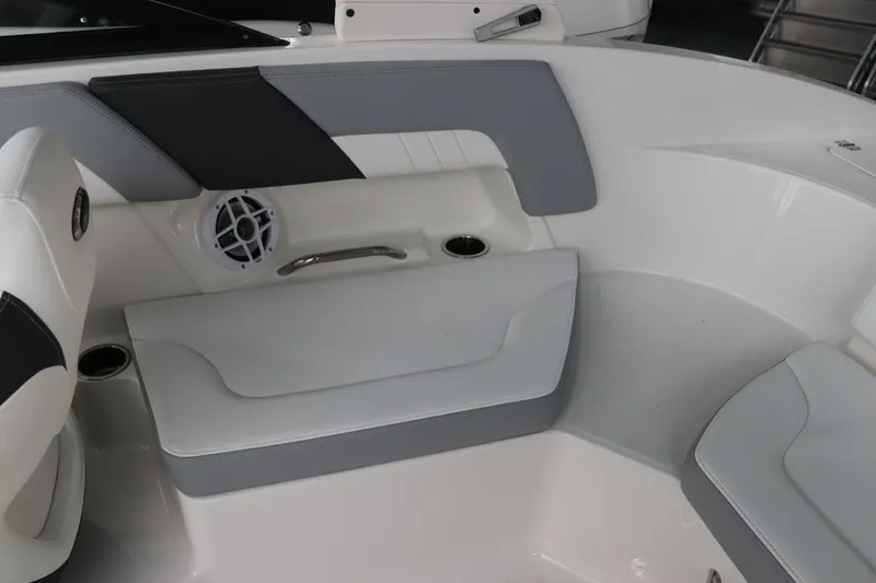 Slide: The Image of 2026 Chaparral 23 SSi OB boat interior with gray and white seating. - 23