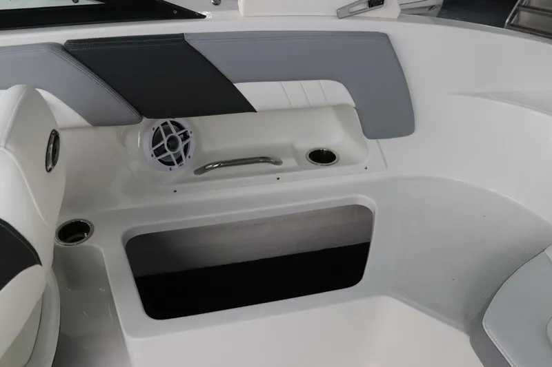 Slide: The Image of Interior of 2026 Chaparral 23 SSi OB boat with speaker and cup holders. - 24