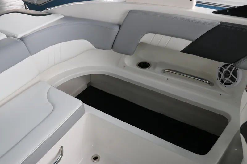 Slide: The Image of Interior seating of 2026 Chaparral 23 SSi OB boat, featuring sleek design and storage space. - 27