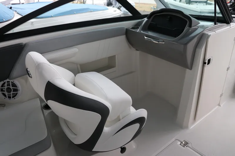 Slide: The Image of 2026 Chaparral 23 SSi OB boat interior with white and black seating. - 28