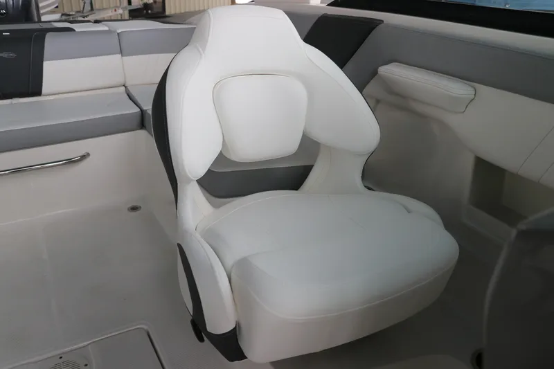 Slide: The Image of 2026 Chaparral 23 SSi OB boat interior with white cushioned seating. - 29