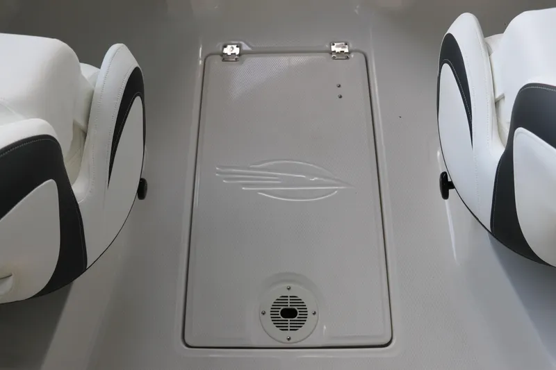 Slide: The Image of 2026 Chaparral 23 SSi OB boat interior with sleek seating and storage compartment. - 34