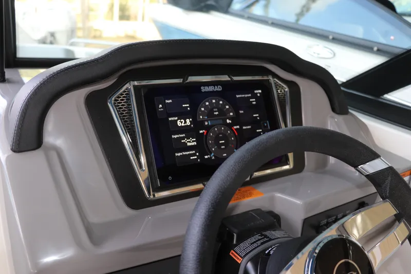 Slide: The Image of Dashboard of 2026 Chaparral 23 SSi OB with Simrad display and steering wheel. - 39
