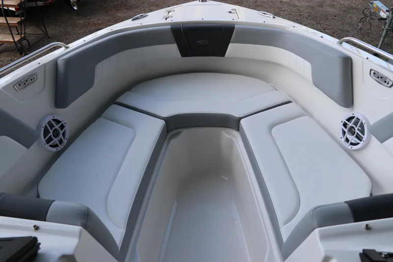 Slide: The Image of 2026 Chaparral 23 SSi OB boat interior with cushioned seating and speakers. - 41