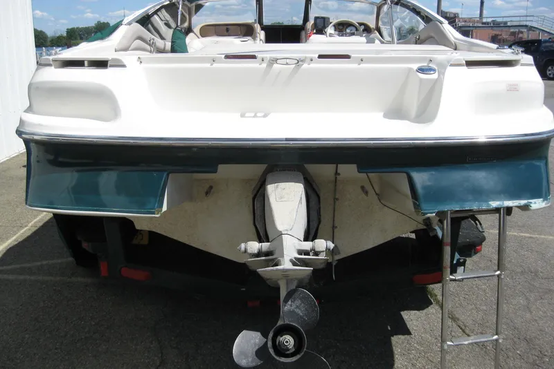 Slide: The Image of 1997 Regal 2100 LSR boat rear view with propeller and ladder. - 6