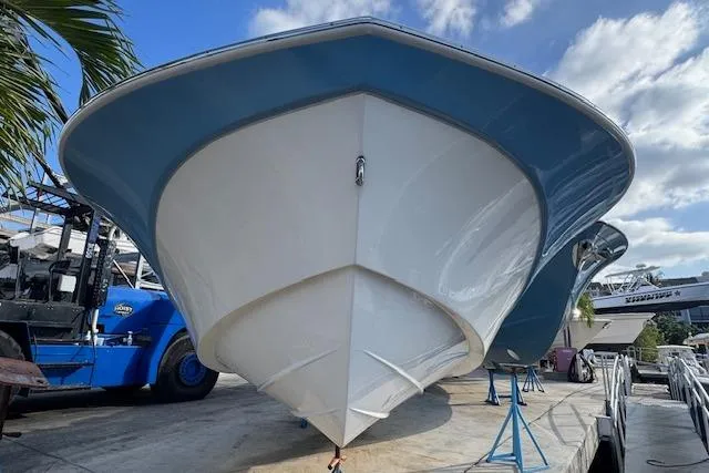 Slide: The Image of 2024 Carolina Skiff 22 Ultra Elite boat on display, viewed from the front. - 3