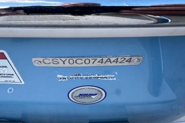 Slide: The Image of 2024 Carolina Skiff 22 Ultra Elite boat identification number on blue hull. - 5