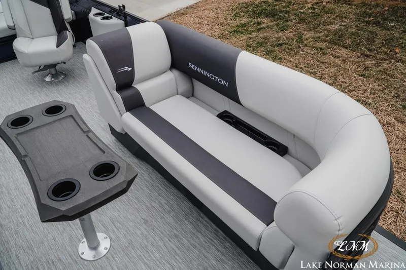Slide: The Image of 2026 Bennington 22SSB SNAP boat interior with gray seating and cup holders. - 19