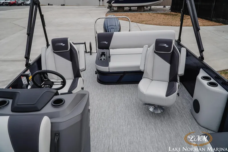 Slide: The Image of 2026 Bennington 22SSB SNAP pontoon boat interior with modern seating and steering console. - 20