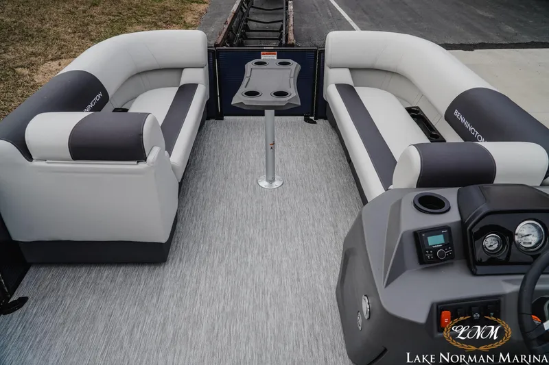 Slide: The Image of 2026 Bennington 22SSB SNAP pontoon boat interior with plush seating and modern console. - 7