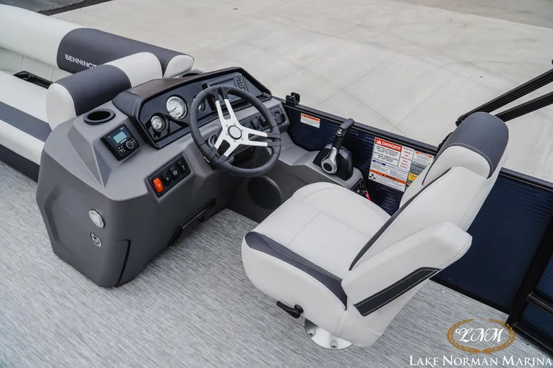 Slide: The Image of 2026 Bennington 22SSB SNAP boat interior with steering console and captain's chair. - 8