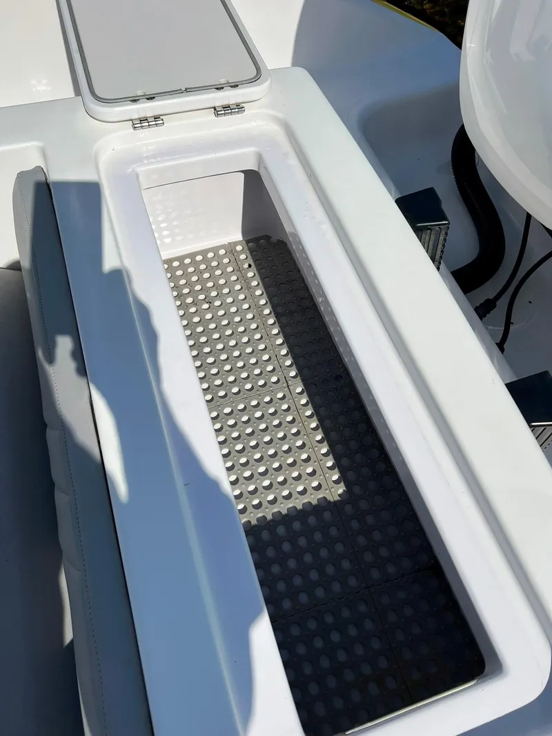 Slide: The Image of Open storage compartment on 2004 Donzi 35 ZF Cuddy boat. - 11