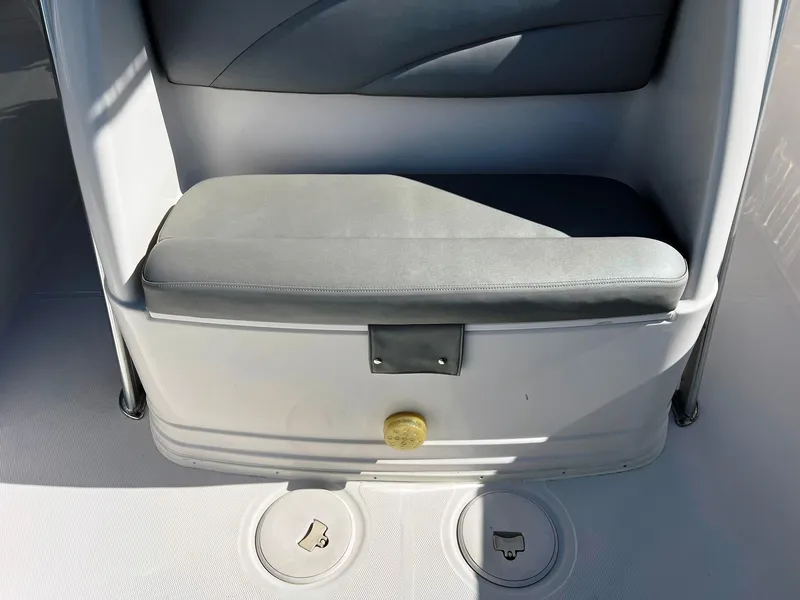 Slide: The Image of 2004 Donzi 35 ZF Cuddy interior seating with storage compartments. - 19