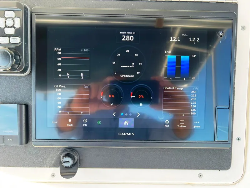 Slide: The Image of Garmin display on 2004 Donzi 35 ZF Cuddy showing engine metrics and navigation data. - 27