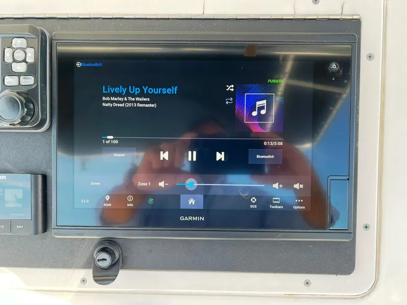 Slide: The Image of Garmin display on 2004 Donzi 35 ZF Cuddy showing music playback. - 28