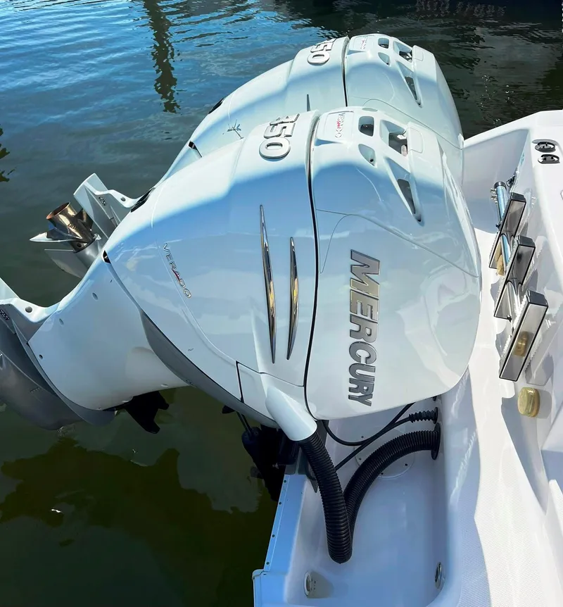 Slide: The Image of 2004 Donzi 35 ZF Cuddy with twin Mercury outboard engines. - 34