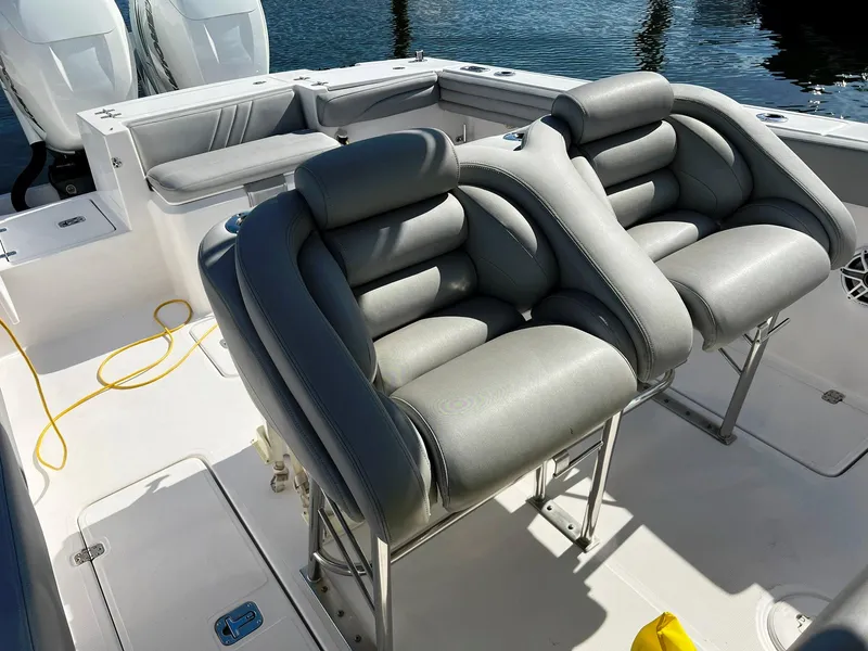 Slide: The Image of 2004 Donzi 35 ZF Cuddy boat interior with plush seating and modern design. - 35