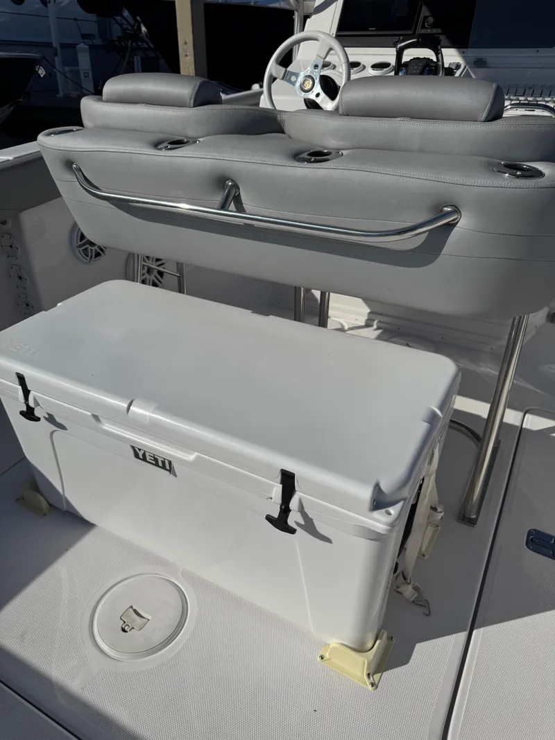 Slide: The Image of 2004 Donzi 35 ZF Cuddy boat interior with Yeti cooler and steering console. - 40