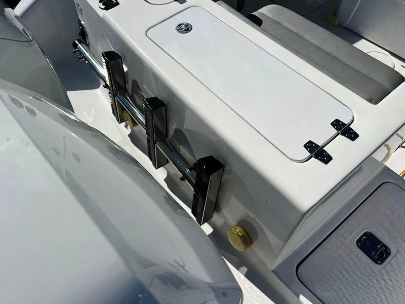 Slide: The Image of 2004 Donzi 35 ZF Cuddy boat interior with storage compartments and seating. - 5