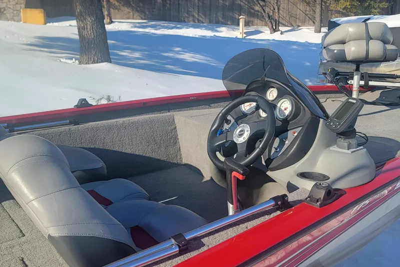 Slide: The Image of 2013 Tracker Pro Team 175 TXW boat interior with steering wheel and gauges. - 3