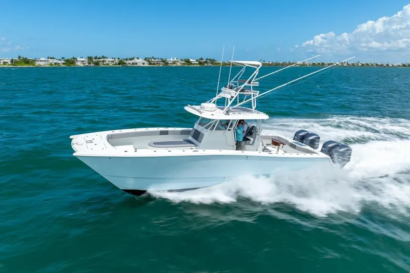 Slide: The Image of 2018 Freeman 37VH boat cruising on blue ocean waters under clear skies. - 1