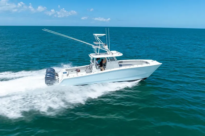 Slide: The Image of 2018 Freeman 37VH boat cruising on open ocean under clear blue sky. - 12