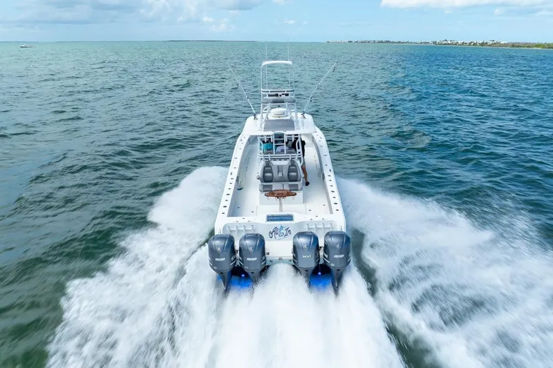 Slide: The Image of 2018 Freeman 37VH boat cruising on open water with powerful engines. - 17