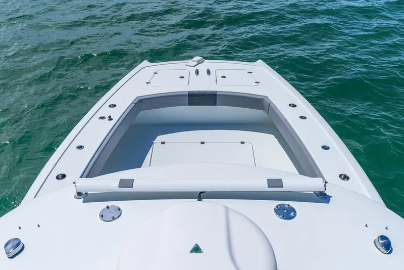 Slide: The Image of 2018 Freeman 37VH boat deck on open water, showcasing sleek design and spacious layout. - 18