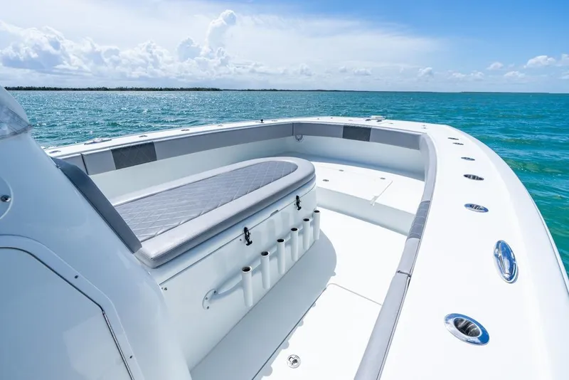 Slide: The Image of 2018 Freeman 37VH boat on open water, featuring spacious seating and sleek design. - 21