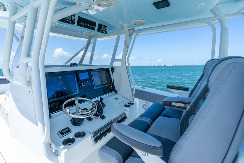 Slide: The Image of Freeman 37VH 2018 boat cockpit with modern controls and ocean view. - 28