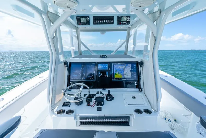 Slide: The Image of Freeman 37VH 2018 boat cockpit with advanced navigation systems on open water. - 29