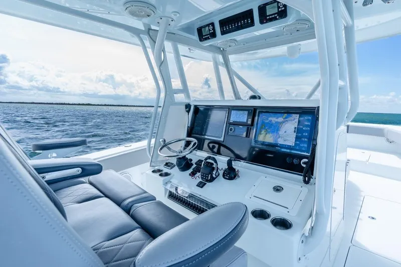 Slide: The Image of 2018 Freeman 37VH boat cockpit with advanced navigation systems on open water. - 30