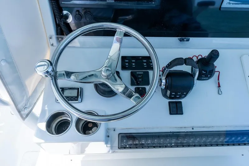 Slide: The Image of Steering console of 2018 Freeman 37VH boat with controls and gauges. - 33