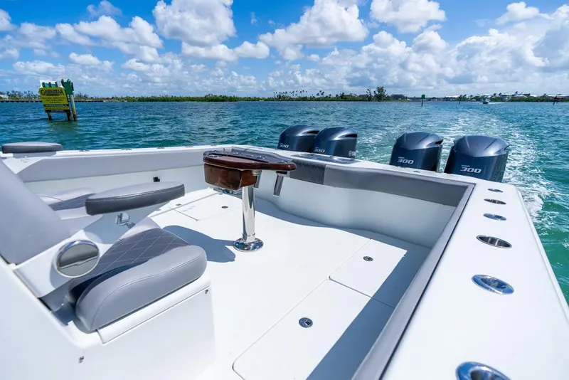 Slide: The Image of 2018 Freeman 37VH boat with quad engines on open water under blue sky. - 40