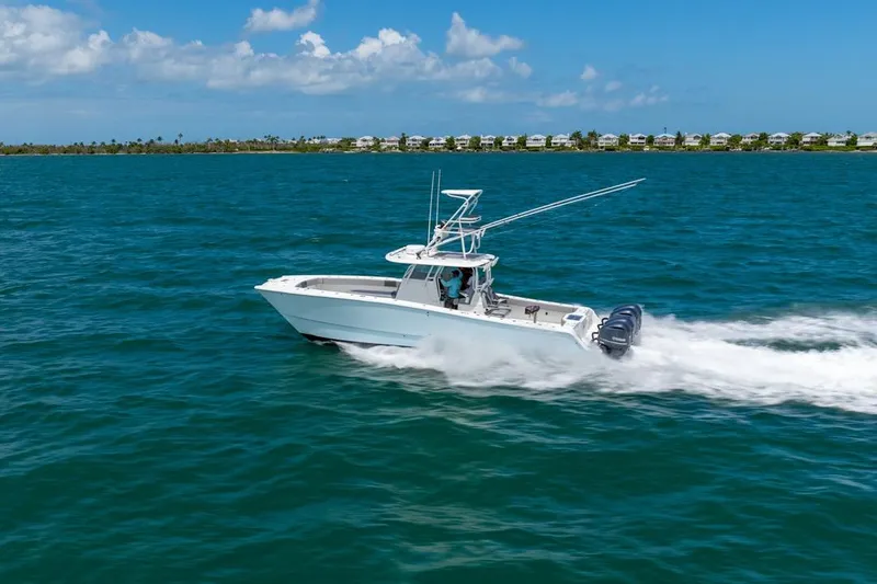 Slide: The Image of 2018 Freeman 37VH boat cruising on blue ocean under clear sky. - 8