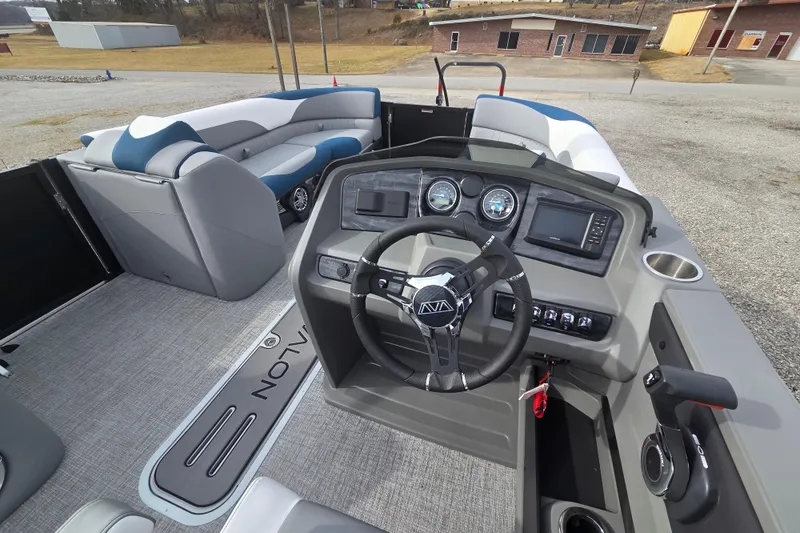 Slide: The Image of 2026 Avalon Platinum LSZ 2585 Cruise Rear Bench boat interior with steering console and seating. - 10