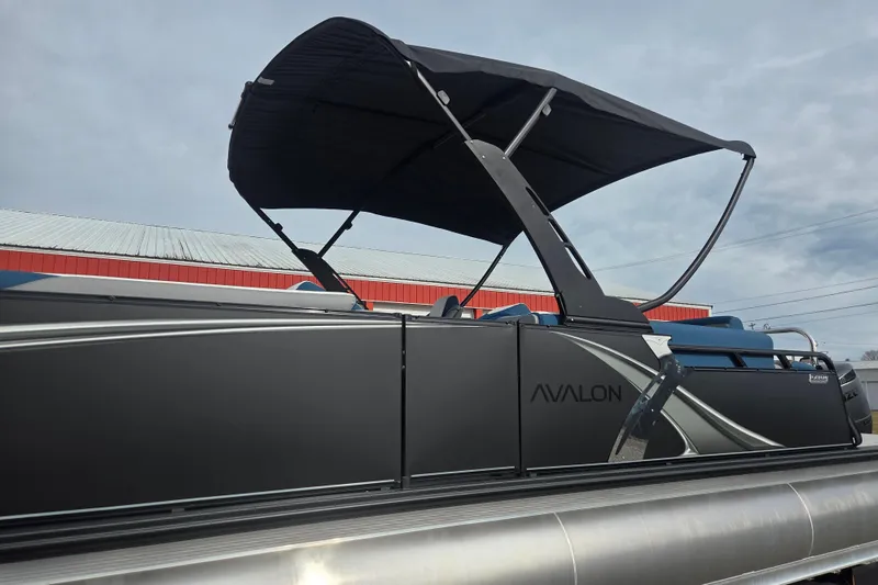 Slide: The Image of 2026 Avalon Platinum LSZ 2585 Cruise Rear Bench pontoon boat with canopy, side view. - 4