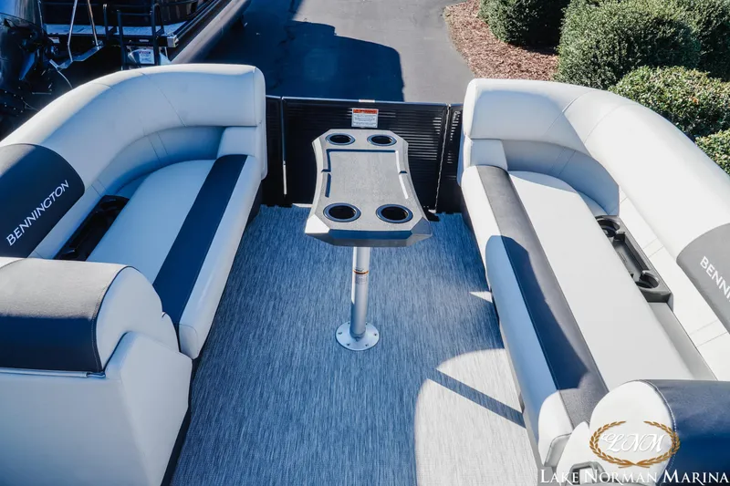 Slide: The Image of 2026 Bennington 22SSB SNAP pontoon boat interior with seating and table. - 11