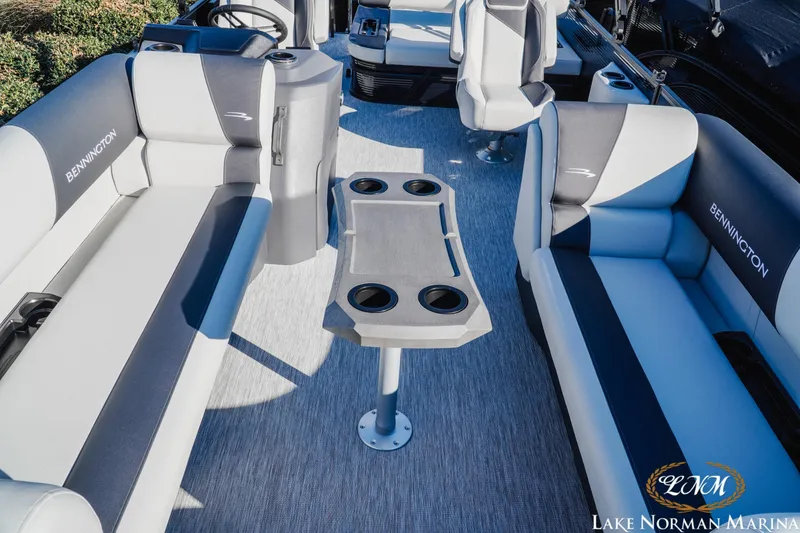 Slide: The Image of 2026 Bennington 22SSB SNAP boat interior with seating and table, Lake Norman Marina. - 13