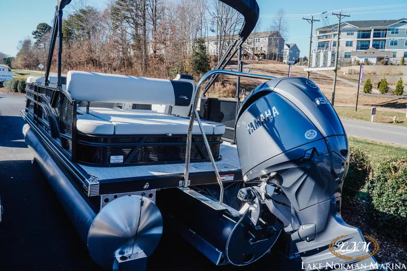 Slide: The Image of 2026 Bennington 22SSB SNAP pontoon boat with Yamaha outboard motor at Lake Norman Marina. - 3