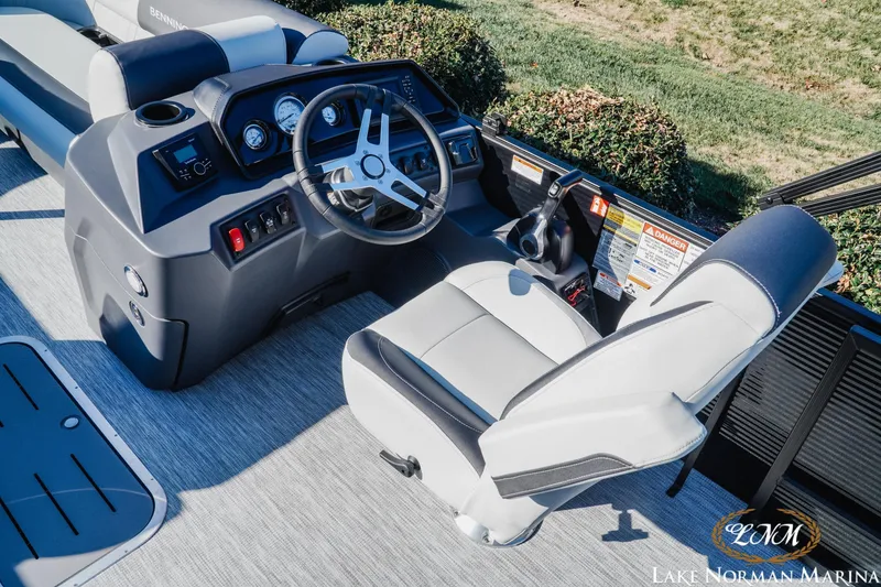 Slide: The Image of 2026 Bennington 22SSB SNAP boat interior with steering wheel and control panel. - 8