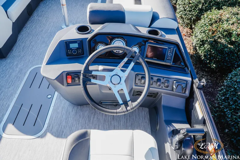 Slide: The Image of 2026 Bennington 22SSB SNAP boat dashboard with steering wheel and control panel. - 9