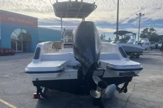 The Image of 2022 Trophy T22 boat with outboard motor in a dealership lot. - 1