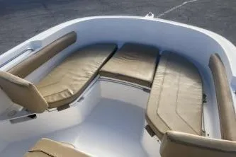 Slide: The Image of 2022 Trophy T22 boat interior with cushioned seating in a sleek design. - 10