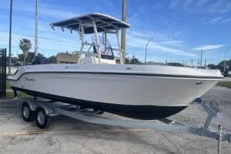 Slide: The Image of 2022 Trophy T22 boat on trailer under blue sky. - 3