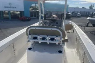 Slide: The Image of 2022 Trophy T22 boat with center console and rod holders, docked at a marina. - 7