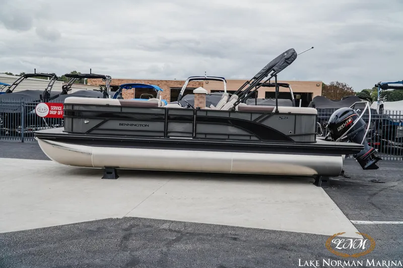 The Image of 2026 Bennington 23SSR pontoon boat at Lake Norman Marina, side view. - 1