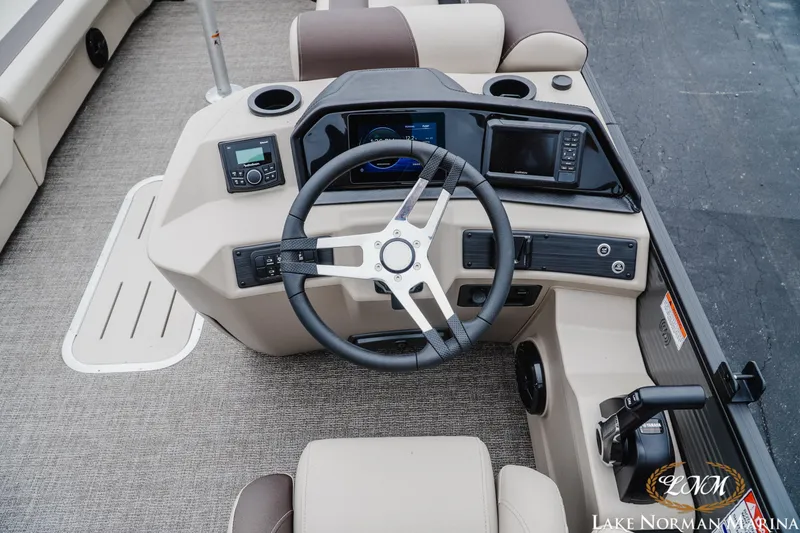Slide: The Image of 2026 Bennington 23SSR boat dashboard with steering wheel and control panel. - 10