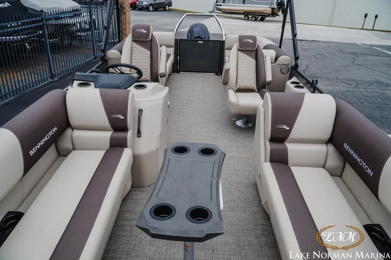 Slide: The Image of 2026 Bennington 23SSR pontoon boat interior with plush seating and modern design at Lake Norman Marina. - 14