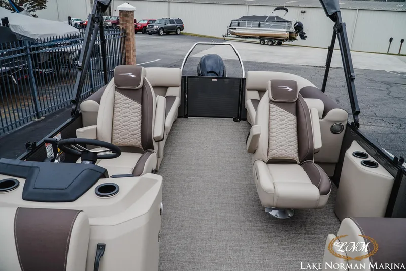 Slide: The Image of 2026 Bennington 23SSR pontoon boat interior with luxurious seating at Lake Norman Marina. - 17